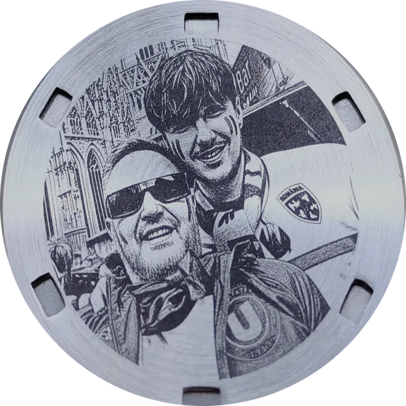 Engraved caseback with a father and son at a football match