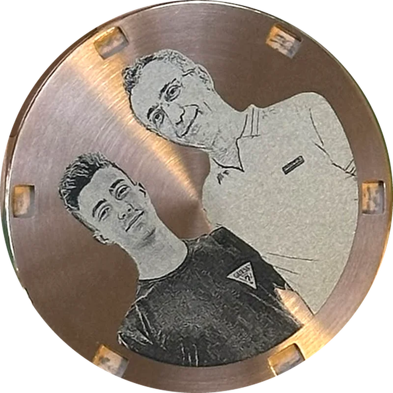 Engraved rose gold caseback with a father and his son